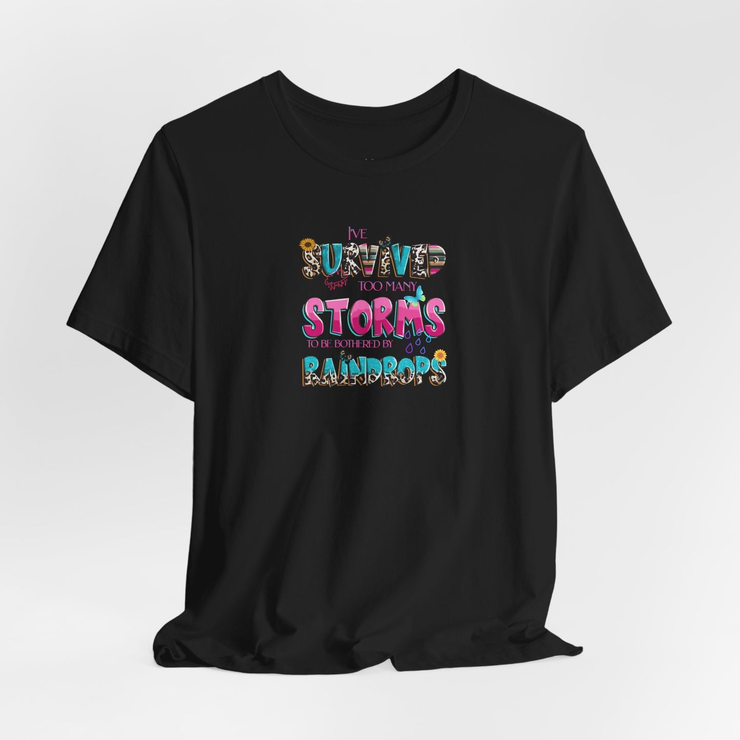 "I've Survived Too Many Storms to Be Bothered by Raindrops" Inspirational Graphic T‑Shirt