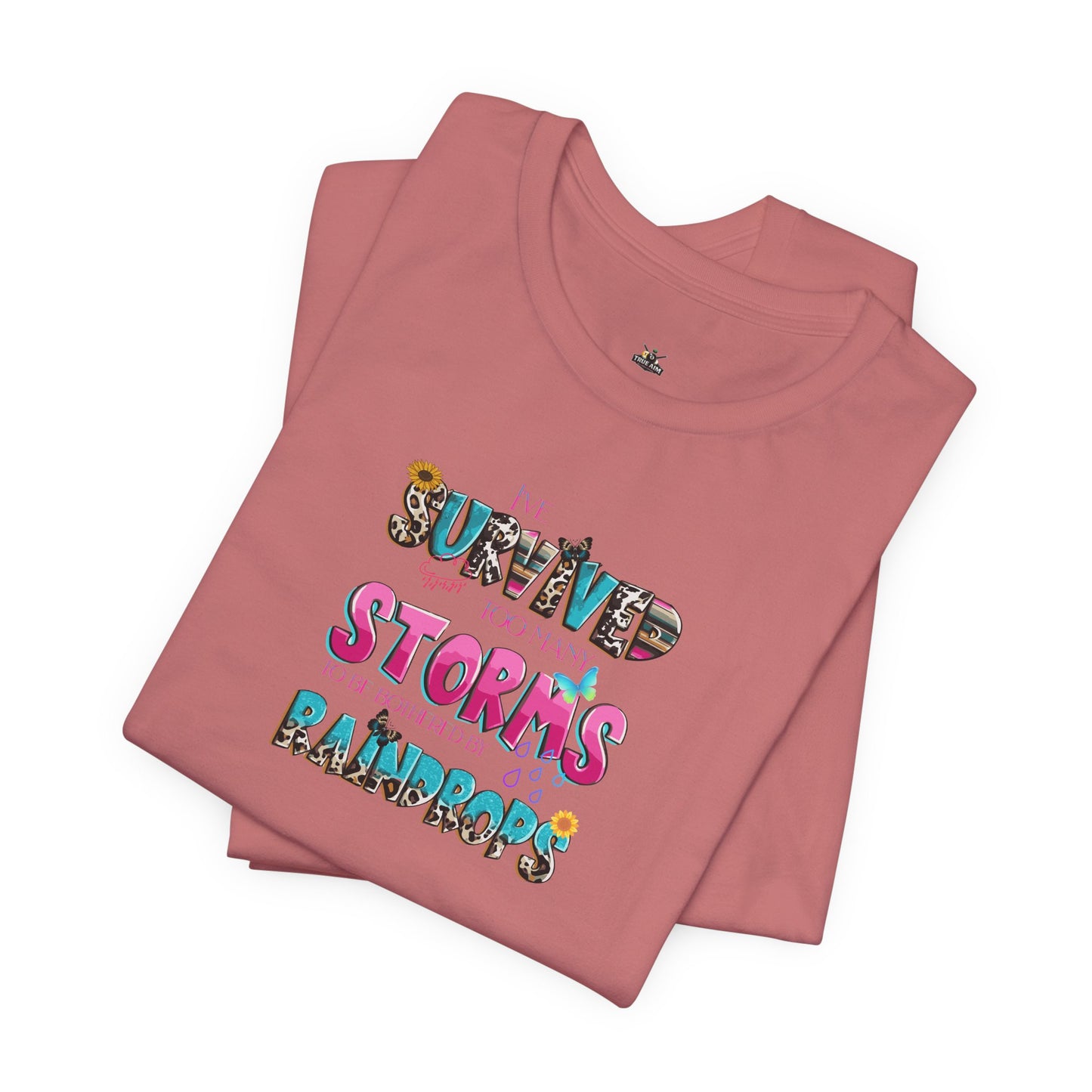 "I've Survived Too Many Storms to Be Bothered by Raindrops" Inspirational Graphic T‑Shirt