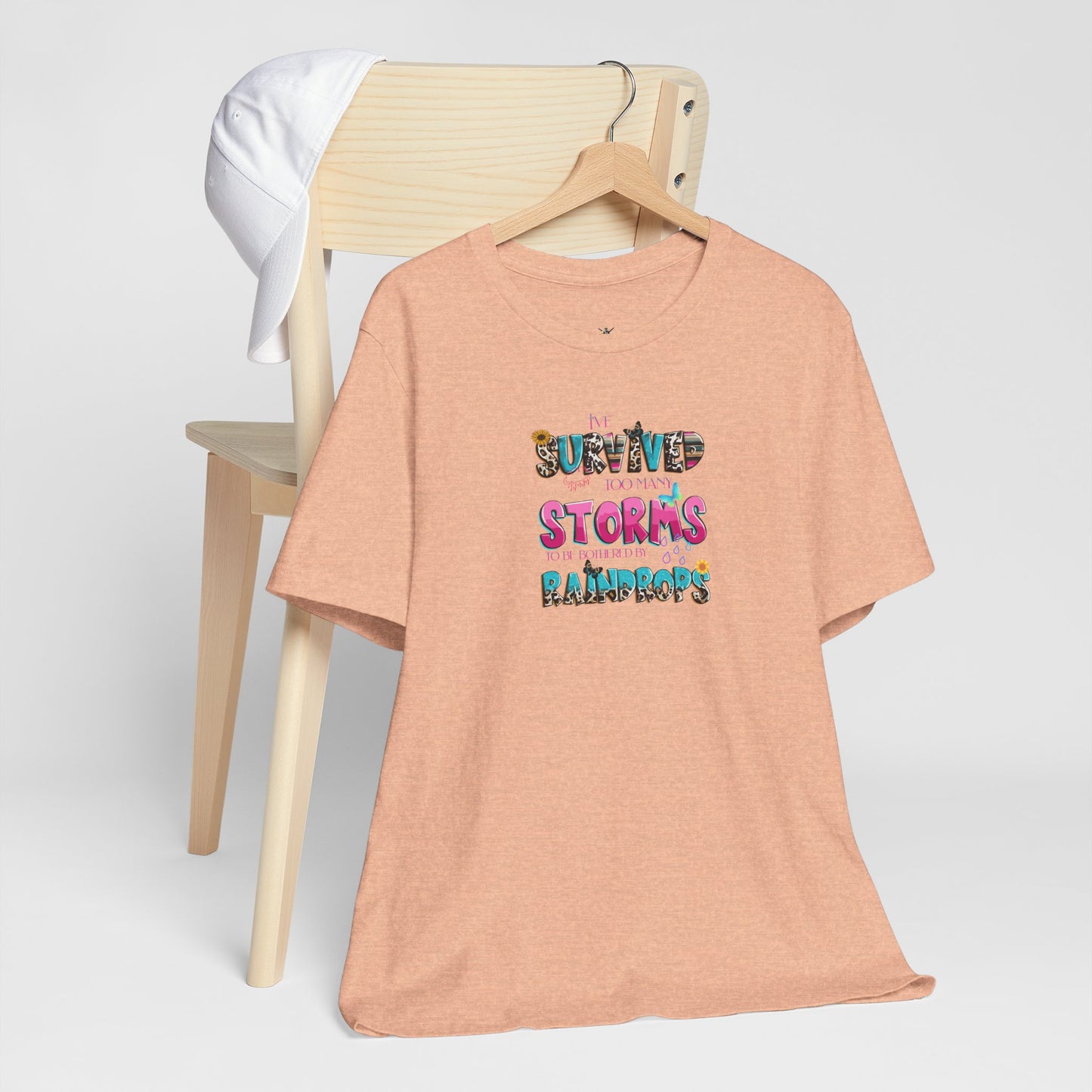 "I've Survived Too Many Storms to Be Bothered by Raindrops" Inspirational Graphic T‑Shirt
